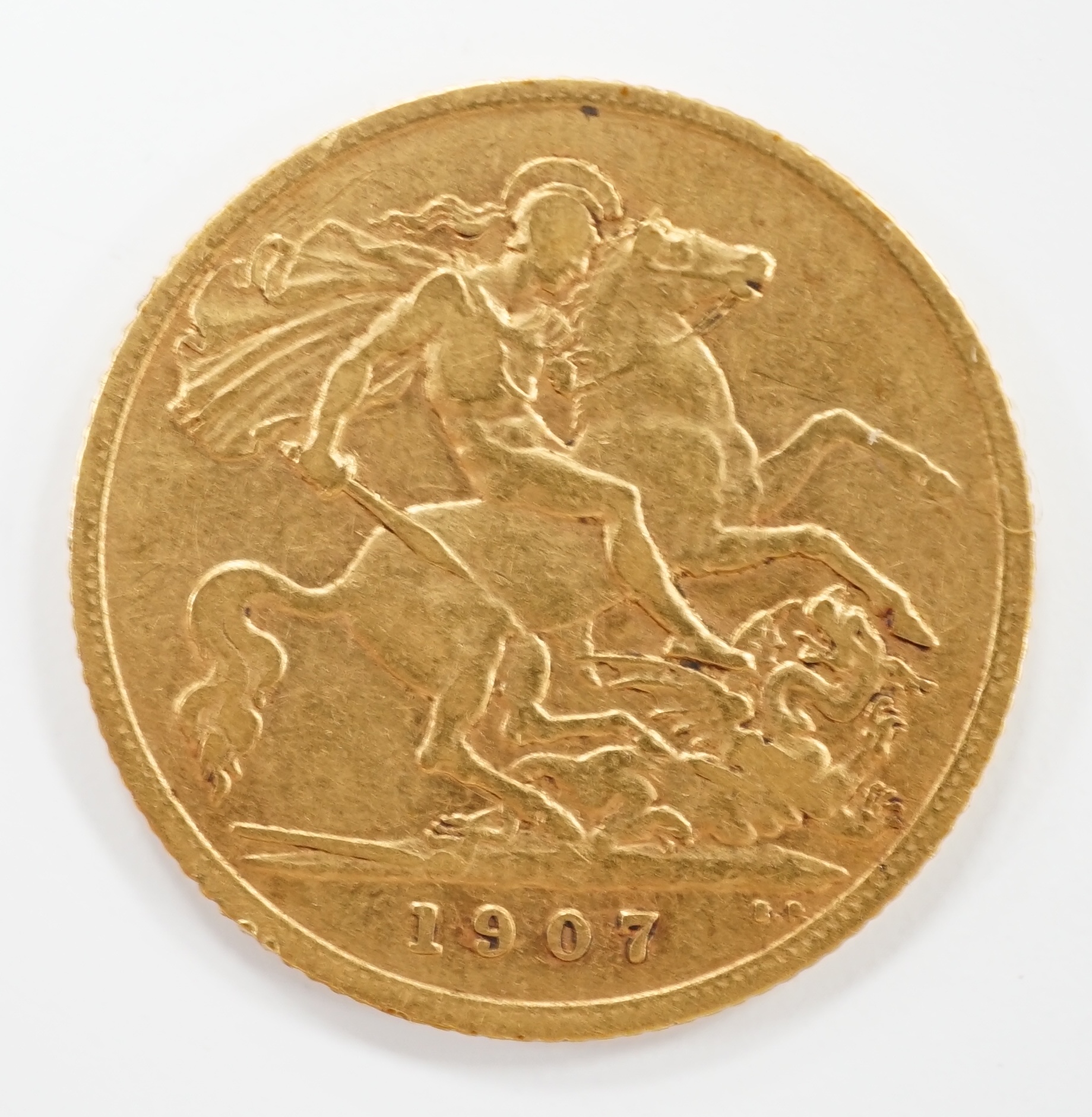 An Edward VII 1907 gold half sovereign.